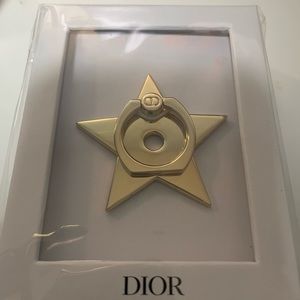 Brand new Dior phone ring, gold, star shaped.
